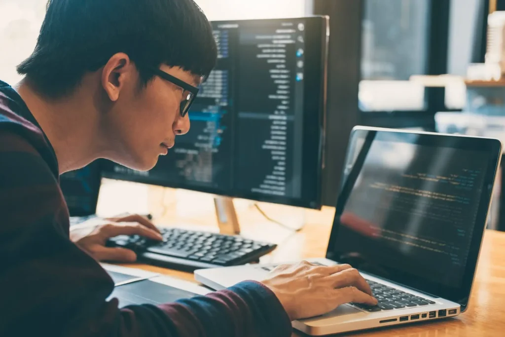 Software developer in the Philippines coding custom software solutions for international clients by Brayne Digital.